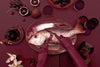 Hand wearing gloves cutting into a fish plated on the fish platter.
